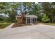 Features a cozy screened porch, perfect for enjoying the outdoors in a relaxed setting with a brick chimney at 1205 Willow Dr, Chapel Hill, NC 27517