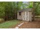 Exterior view of a storage shed with a small ramp and decorative doors at 1205 Willow Dr, Chapel Hill, NC 27517
