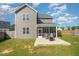 Exterior view of the house with screened-in patio, and expansive backyard at 123 Teaser Dr, Fuquay Varina, NC 27526