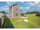 A spacious backyard with a lush green lawn and a charming patio, perfect for outdoor entertainment and leisure at 123 Teaser Dr, Fuquay Varina, NC 27526