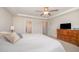 Bedroom boasts a ceiling fan, neutral carpeting, and direct bathroom access at 123 Teaser Dr, Fuquay Varina, NC 27526