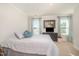 Bright and airy bedroom with neutral carpeting and gray comforter at 123 Teaser Dr, Fuquay Varina, NC 27526