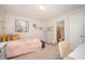 Cozy bedroom with colorful decor, a comfortable bed, and adjacent bathroom at 123 Teaser Dr, Fuquay Varina, NC 27526
