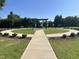 A serene common area with walkways and lush landscaping, offering a peaceful environment for residents at 123 Teaser Dr, Fuquay Varina, NC 27526