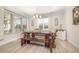Dining room with rustic table, benches, and views of the exterior at 123 Teaser Dr, Fuquay Varina, NC 27526