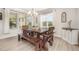 Dining room with rustic table, benches, and an abundance of natural light at 123 Teaser Dr, Fuquay Varina, NC 27526
