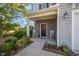 Inviting front porch with rocking chairs and decorative details adding a touch of Southern charm at 123 Teaser Dr, Fuquay Varina, NC 27526