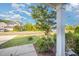 Landscaped front yard with lush green grass and trees along a quiet street at 123 Teaser Dr, Fuquay Varina, NC 27526