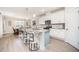 Open kitchen and dining area with marble counters, stainless appliances, and eat-in dining at 123 Teaser Dr, Fuquay Varina, NC 27526