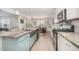 Open kitchen with stainless appliances, granite counters, and an eat-in breakfast nook at 123 Teaser Dr, Fuquay Varina, NC 27526