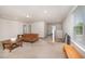 Spacious living room featuring a comfortable sofa and access to upper and lower floors at 123 Teaser Dr, Fuquay Varina, NC 27526