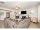 Bright living room with a fireplace, neutral color scheme, and a comfortable sectional sofa at 123 Teaser Dr, Fuquay Varina, NC 27526