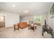 Open living room with seating, TV, neutral tones, and natural light at 123 Teaser Dr, Fuquay Varina, NC 27526