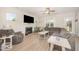 Cozy living room with a fireplace, neutral color scheme, and a large sectional sofa at 123 Teaser Dr, Fuquay Varina, NC 27526