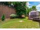 Spacious backyard features lawn, mature trees, and an outdoor shed at 1320 Cozy Oak Ave, Cary, NC 27519
