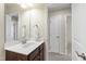 Bathroom vanity featuring a single sink and view of an ensuite bedroom at 1320 Cozy Oak Ave, Cary, NC 27519