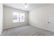 Bedroom featuring neutral carpet, white walls, and a window with blinds at 1320 Cozy Oak Ave, Cary, NC 27519