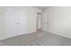 Bedroom featuring neutral carpet, double doors, and a bright white trim at 1320 Cozy Oak Ave, Cary, NC 27519