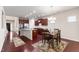 Open concept kitchen and dining area with hardwood floors and modern lighting at 1320 Cozy Oak Ave, Cary, NC 27519