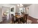 Cozy dining area with a wood table, chairs, and views into other living spaces at 1320 Cozy Oak Ave, Cary, NC 27519