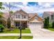 Traditional home with a well-maintained lawn, two-car garage, and inviting curb appeal at 1320 Cozy Oak Ave, Cary, NC 27519