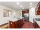 Spacious kitchen island with granite countertops and stainless steel appliances, with view of staircase at 1320 Cozy Oak Ave, Cary, NC 27519