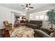 Comfortable living room featuring a ceiling fan, an open floor plan, and warm, inviting decor at 1320 Cozy Oak Ave, Cary, NC 27519