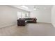 Large loft area with neutral carpeting, a ceiling fan, and a comfortable sectional sofa at 1320 Cozy Oak Ave, Cary, NC 27519