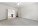 Spacious main bedroom with neutral carpet leading to an en-suite bathroom at 1320 Cozy Oak Ave, Cary, NC 27519