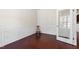 Cozy office space with hardwood floors, wainscoting, and a glass door, perfect for work at 1320 Cozy Oak Ave, Cary, NC 27519
