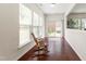 Bright sunroom with large windows and a sliding door to the backyard at 1320 Cozy Oak Ave, Cary, NC 27519