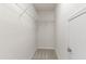 Walk-in closet featuring neutral carpet and wire shelving at 1320 Cozy Oak Ave, Cary, NC 27519
