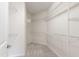 Empty walk-in closet with white wire shelving and neutral carpeting at 1320 Cozy Oak Ave, Cary, NC 27519