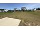 View of the grassy backyard and other homes in the neighborhood at 14 Gallop Rein Cir, Benson, NC 27504