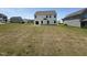 Exterior view of the home and flat backyard in a neighborhood setting at 14 Gallop Rein Cir, Benson, NC 27504