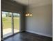 Bright dining space featuring laminate flooring and a glass sliding door at 14 Gallop Rein Cir, Benson, NC 27504