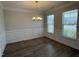 Open dining area featuring hardwood floors and stylish chandelier lighting at 14 Gallop Rein Cir, Benson, NC 27504