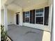 Inviting covered porch featuring large windows, providing plenty of natural light at 14 Gallop Rein Cir, Benson, NC 27504