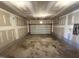 A spacious unfinished two-car garage with plenty of storage at 14 Gallop Rein Cir, Benson, NC 27504
