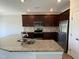 Modern kitchen equipped with stainless steel appliances and granite countertops at 14 Gallop Rein Cir, Benson, NC 27504