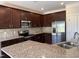 Well-equipped kitchen with stainless steel appliances and beautiful granite countertops at 14 Gallop Rein Cir, Benson, NC 27504