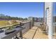 Private balcony with outdoor seating and a view of a construction site in a new community at 1501 Village Hall Ln # 38, Wake Forest, NC 27587