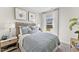 Cozy bedroom features soft gray walls, elegant artwork, and comfortable bedding with decorative pillows at 1501 Village Hall Ln # 38, Wake Forest, NC 27587