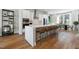 Modern kitchen features a large island with seating, stainless steel appliances, and hardwood floors at 1501 Village Hall Ln # 38, Wake Forest, NC 27587