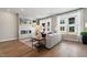 Cozy living room features a fireplace, a comfortable sofa, large windows, and stylish decor at 1501 Village Hall Ln # 38, Wake Forest, NC 27587