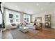 Bright living room featuring a comfortable sofa, large windows with natural light, and stylish decor at 1501 Village Hall Ln # 38, Wake Forest, NC 27587
