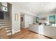 Spacious living room with an open floor plan, large TV, hardwood floors, and comfortable seating at 1501 Village Hall Ln # 38, Wake Forest, NC 27587