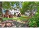 Lush backyard with a manicured lawn and patio area, ideal for outdoor entertaining at 1610 Ridge Rd, Raleigh, NC 27607