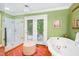 Bright bathroom with a glass-enclosed shower, a luxurious tub, and access to the backyard at 1610 Ridge Rd, Raleigh, NC 27607