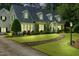 Charming two-story home with a well-manicured lawn, stone walkway, and inviting front porch at 1610 Ridge Rd, Raleigh, NC 27607